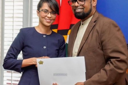 Attorney Pauline Chase being congratulated by President Irfaan Ali after accepting her instrument of appointment on July 8 last year.