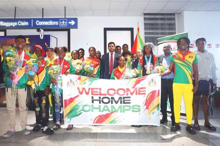 The CARIFTA Games contingent which represented Guyana in the Bahamas during the Easter weekend returned to a patriotic welcome yesterday at the Cheddi Jagan International Airport. They were welcomed by Minister of Culture, Youth and Sport, Charles Ramson Jr., Director of Sport, Steve Ninvalle, Vice President of the Guyana Olympic Association, Cristy Campbell, proud parents, well-wishers, members of the Athletic body and media operatives. (Emmerson Campbell photo)
