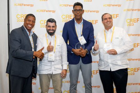 Farfan & Mendes and Soventix Caribbean officials receiving their award from a CREF official (CREF 2023 photo)