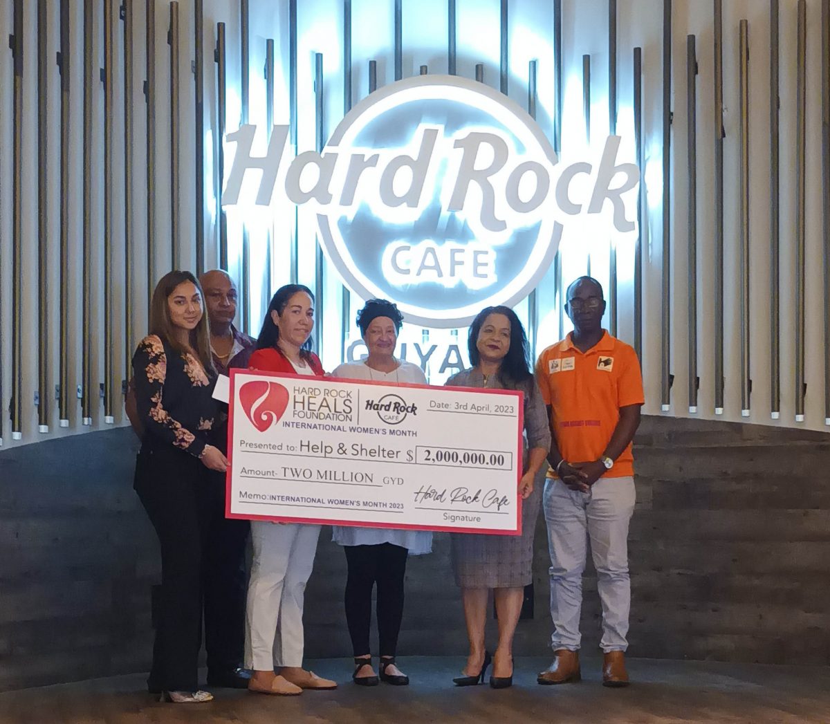 Members of Help and Shelter with representatives of Hard Rock® Café Guyana at the handing over.
