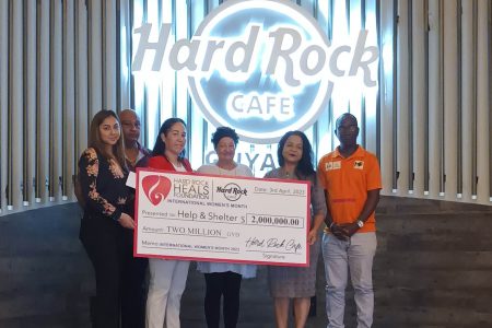 Members of Help and Shelter with representatives of Hard Rock® Café Guyana at the handing over.
