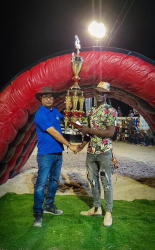 Rodeo King Joshua Gaskin receiving his trophy (A path to travel photo)
