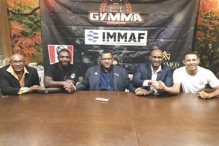 Unified! Pan American Federation President Jason Fraser (centre) and GMMAF Chief and new Pan Am executive Gavin Singh (2nd from right) posing for the cameras following the official confirmation of the latter’s appointment to the regional committee. Also in the photo from left are GMMAF member, Charles Greaves; Suriname MMA executive, Benito Linger; and MMA trainer Eric Alexandre