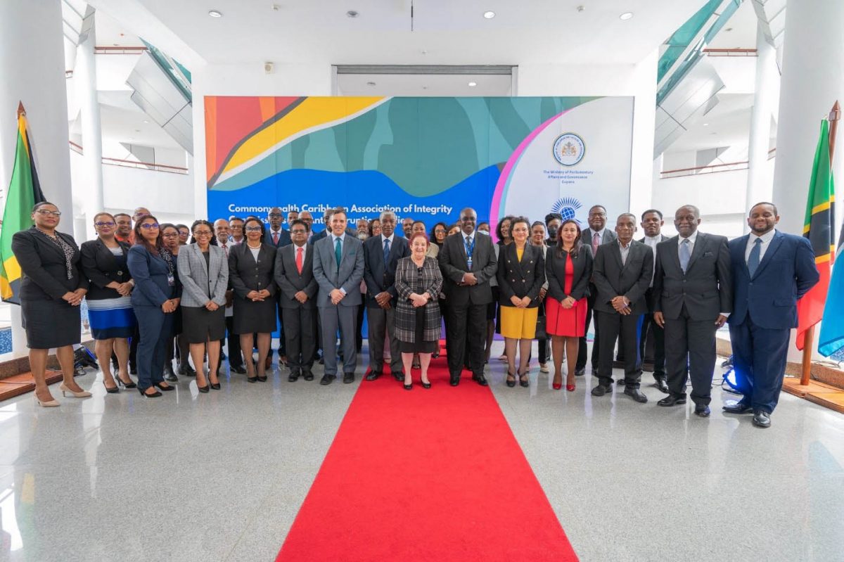 Minister of Governance and Parliamentary Affairs Gail Teixeira (centre) with some of those who attended the conference.  (MGPA photo) 