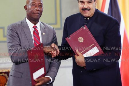 Trinidad PM Keith Rowley shakes hands with Venezuelan President Nicolas Maduro  back in August 2018, to seal the deal that will see TT for the first time, processing Venezuelan natural gas (A TT Express file photograph)