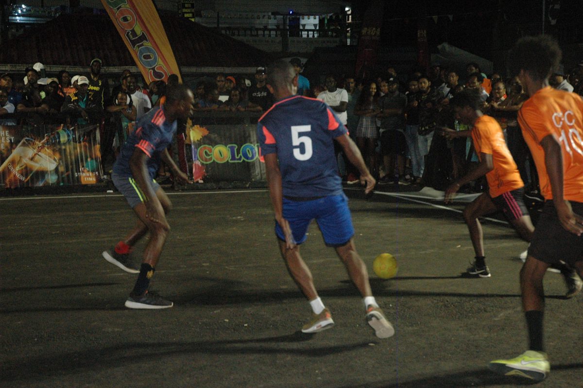 Action in the Guinness ‘Greatest of the Streets’ Linden Championship between Silver Bullets (orange) and Top Striker
