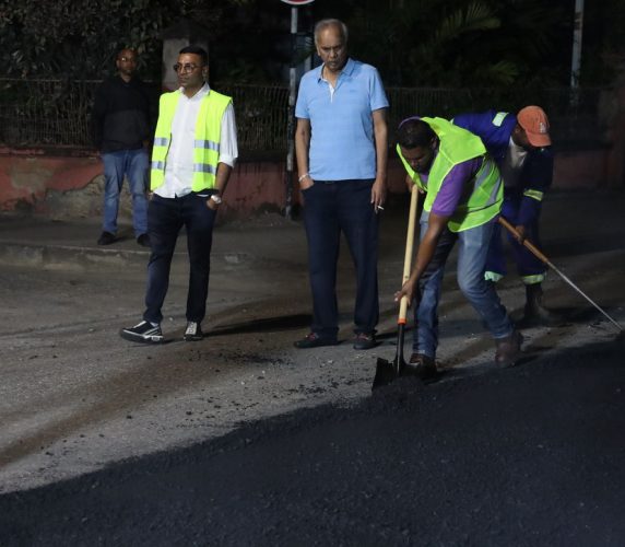 Contractor Junior Sammy looks at his workers during a road paving exercise along Duke Street, Port-of-Spain, in January. ROBERTO CODALLO