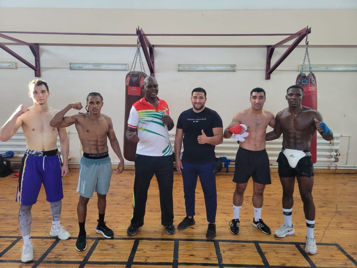  Olympian, Keevin Allicock (second from left), Coach, Terrence Poole (third from left) along with Sportsman
of the Year, Desmond Amsterdam (far right) posing with some other participants of the high level training
camp following a sweat drenched session in Tashkent, Uzbekistan.