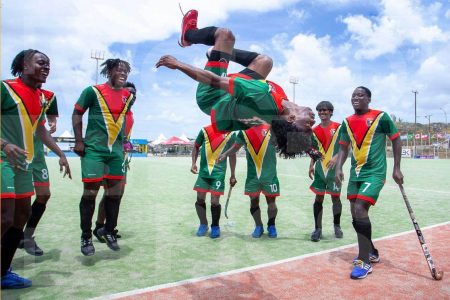 Guyana men’s U21 captain Shakeem Fausette does a celebratory back flip after the team defeated Brazil