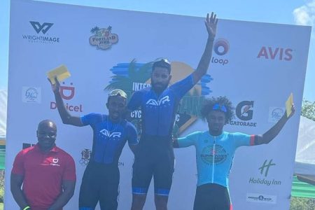 Local star cyclist, Briton John (right) finished on the podium in the initial stage of the Jamaican Cycling Classic Montego Bay race yesterday.
