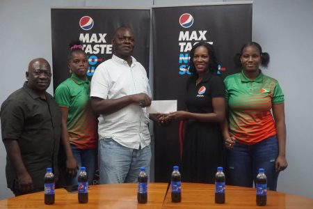 Technical Director of the GBA, Terrence Poole MS, received the sponsorship for the GBA from Schemel Patrick, Brand Communications Manager of DDL as GBA’s Assistant Secretary/Treasurer, Seon Bristol and boxers, Alesha and Abiola Jackman look on. (Emmerson Campbell photo)