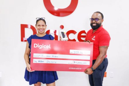 Digicel’s Marketing Manager Ramesh Rupchand (right) and a representative of the Rupununi Rodeo (Digicel photo)