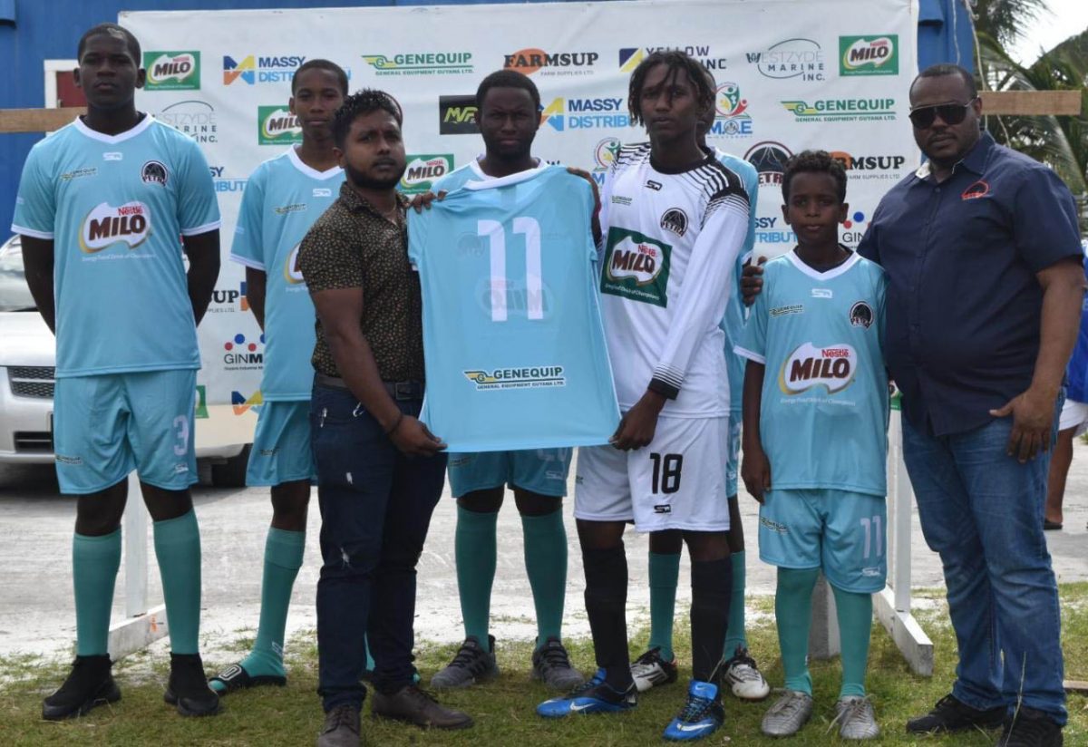 Muneshwar Ganga of GENEQUIP presenting one of the kits to one of the participating teams in the presence of Petra Organization Co-Director Troy Mendonca.