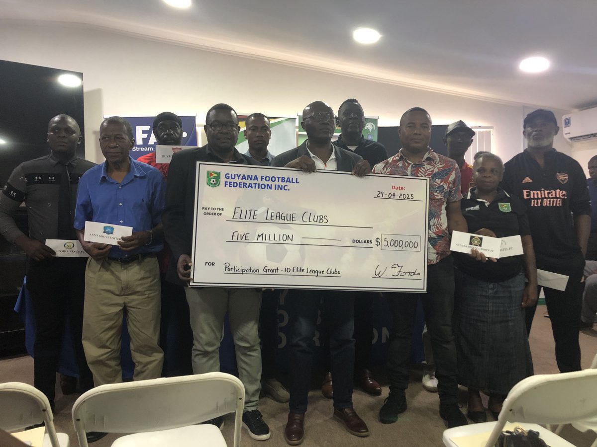 GFF General Secretary Ian Alves displaying the participation grant in the presence of Elite League team officials which will be afforded to the competing sides prior to the start of Season Five 