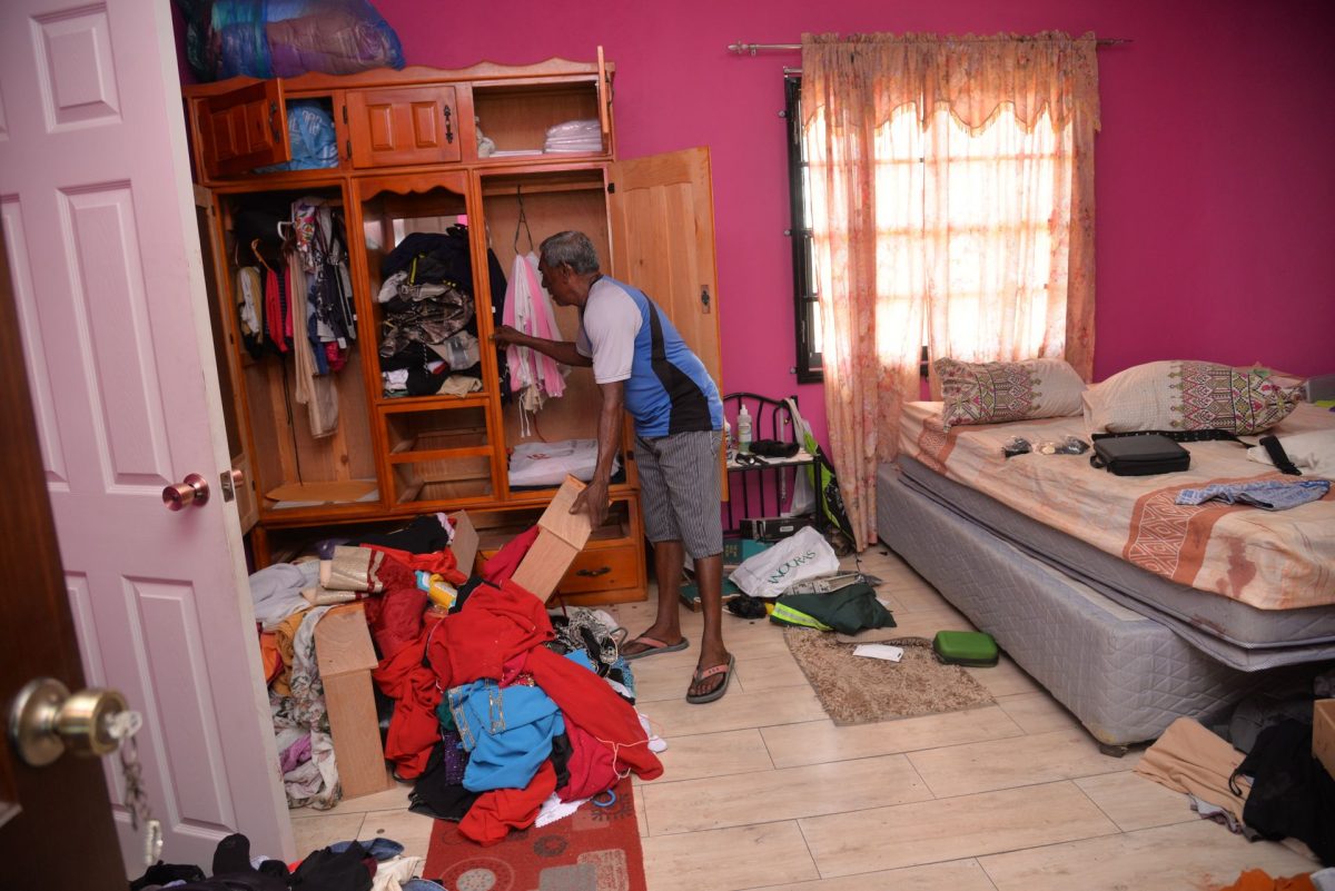 Rasheed Ghany goes through the items in his room which was ransacked during a home invasion