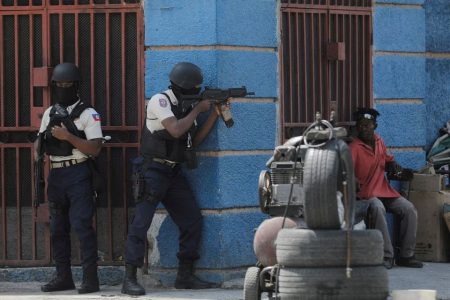 Police officers take position as they take part in an anti-gang operation amid gang violence in Port-au-Prince, Haiti March 3, 2023. REUTERS/Ralph Tedy Erol/File Photo