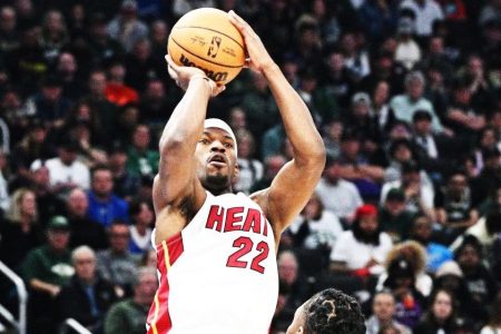 Milwaukee, Wisconsin, USA; Miami Heat forward Jimmy Butler (22) shoots the ball against Milwaukee Bucks forward Jae Crowder (99) in the first half during game one of the 2023 NBA Playoffs at Fiserv Forum yesterday. Mandatory Credit: Michael McLoone-USA TODAY Sports