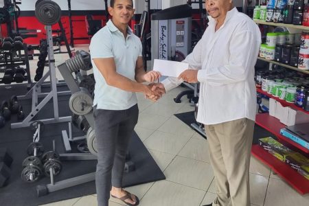 Jamie McDonald (left), CEO of Guyana’s leading fitness supplements and gym equipment supplier, recently made a presentation to CARIFTA Games Team Manager, Keith Campbell to help offset some of the traveling contingent’s expenses to the event in the Bahamas.

