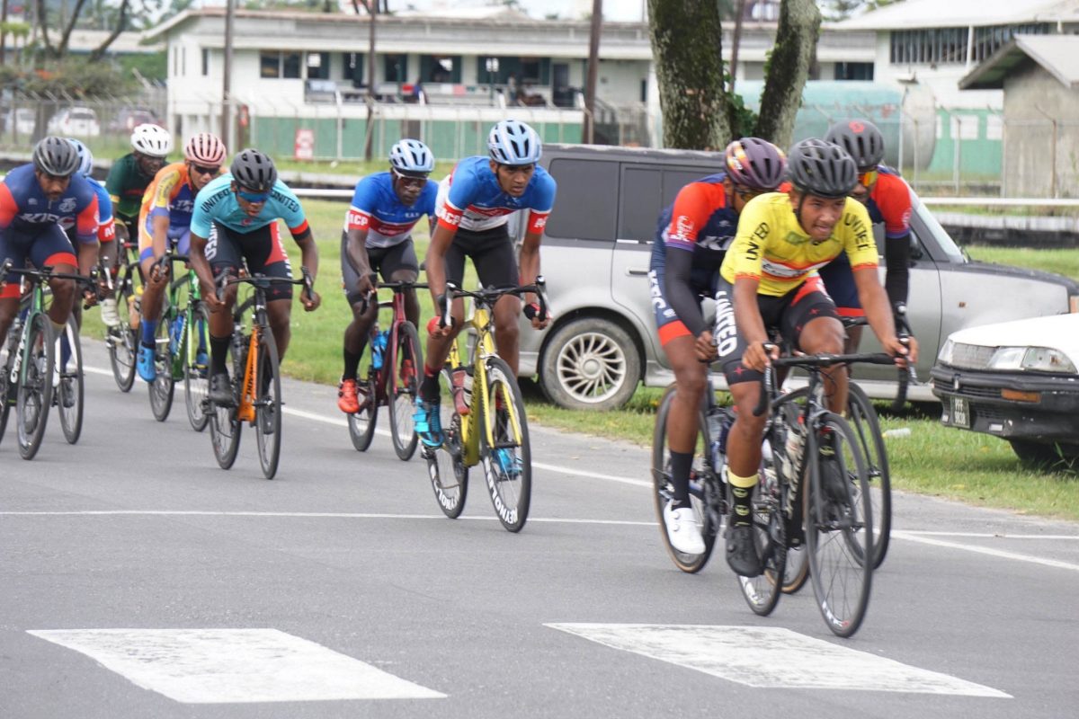Top junior rider, Alex Leung, (in yellow) was part of the initial break yesterday and went onto finish fourth in the event where Team KFC Evolution riders, Curtis Dey, Christopher Griffith and Robin Persaud finished 1-2-3 to sweep the podium places. (Emmerson Campbell photo)