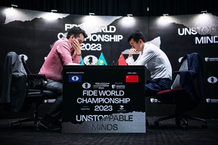 Ian Nepomniachtchi, left and Ding Liren in action during their FIDE World Chess Champion title match.