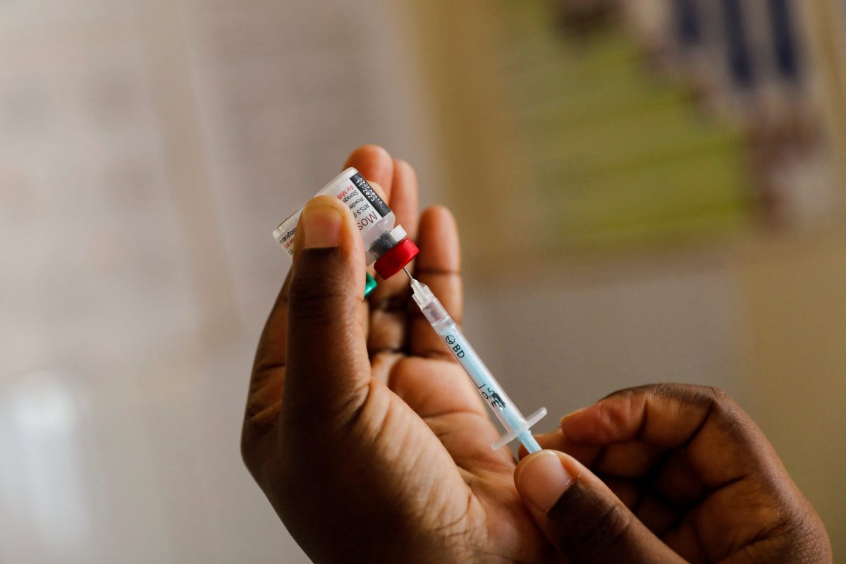 FILE PHOTO: A nurse fills a syringe with malaria vaccine before administering it to an infant at the Lumumba Sub-County hospital in Kisumu, Kenya, July 1, 2022. REUTERS/Baz Ratner