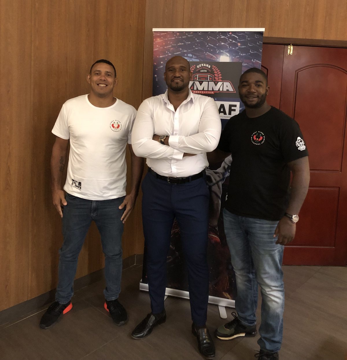 GMMAF President Gavin Singh (centre) sandwiched between Suriname’s MMA executive and coach, Benito Linger (right), and experienced MMA trainer and former competitor, Eric Alexandre. The duo will spearhead the local association’s coaching drive