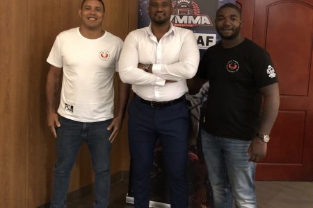 GMMAF President Gavin Singh (centre) sandwiched between Suriname’s MMA executive and coach, Benito Linger (right), and experienced MMA trainer and former competitor, Eric Alexandre. The duo will spearhead the local association’s coaching drive
