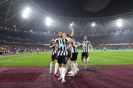 Newcastle United players celebrate their 5-1 thrashing of West Ham United yesterday