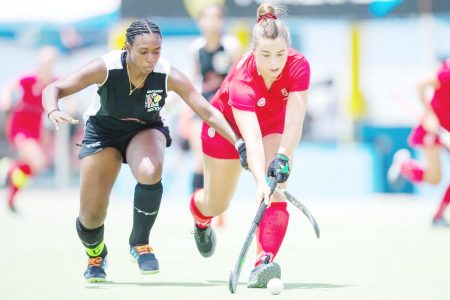  Guyana’s captain Makeda Harding defends stoutly against her Canadian counterpart.