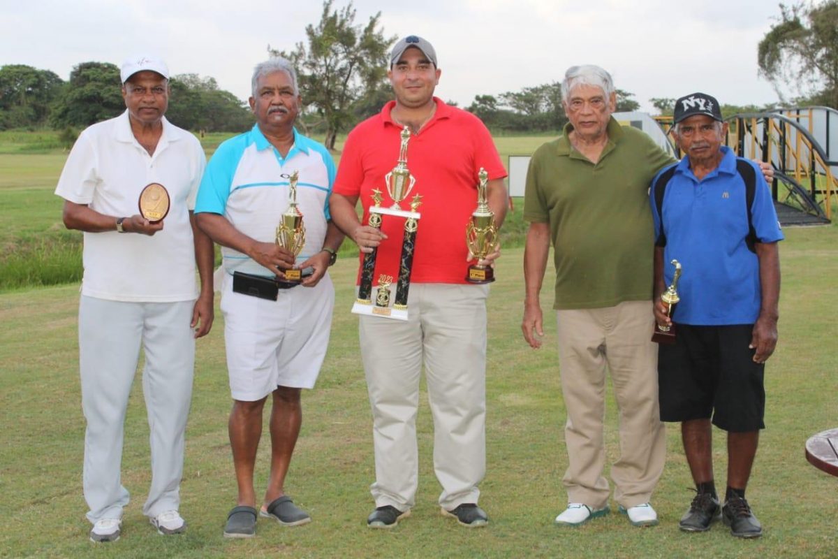 The Winner Miguel Yunes (centre) flanked by Robert Hanoman (second right) and Maurice Deo far right. Loak Punit is at  left with Hilbert Shields (second from left).