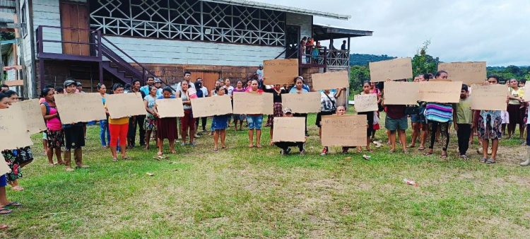 Residents of Chenapou at a demonstration calling for justice 