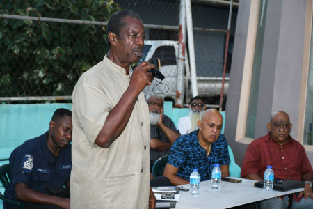 Retired Senior Superintendent, Kenny McIntyre, as he addressed the town meeting at Calcutta Road #2, on Sunday 7 May 2023. [Image by SHASTRI BOODAN]