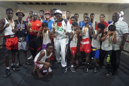 The boxers along with Technical Director of the Guyana Boxing Association along with the association’s executive member, Seon Bristol pose for a photo at the conclusion of the Pepsi/Mike Parris School Boys/ Juniors championship at the Andrew ‘Sixhead’ Lewis Gym yesterday.(Emmerson Campbell photo)