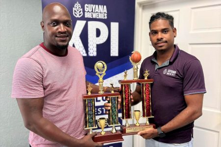 GBI Brand Manager Seweon McGarrell (right) handing over the trophies to LABA President Rawle Toney
