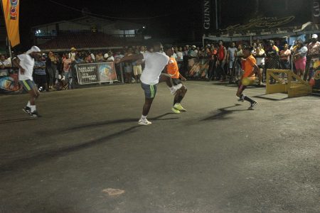 Donovan Francis of Swag Entertainment (white) uncorking a left footed volley against Silver Bullets in the Guinness ‘Greatest of the Streets’ Linden Championship on Wednesday evening
