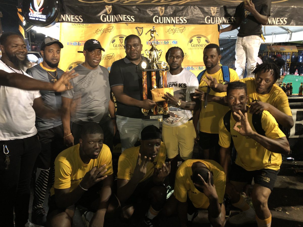 History! Banks DIH Linden Branch Manager Sean Grant presenting the championship trophy to the victorious Swag Entertainment in the presence of teammates and tournament officials, after securing their historic third consecutive zonal title