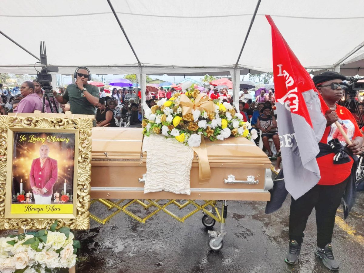Sir Mars’ casket and accompanying photo at the National Cultural Centre tarmac