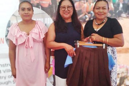 The Minister of Amerindian Affairs, Pauline Sukhai (centre) with two graduates (DPI photo)
