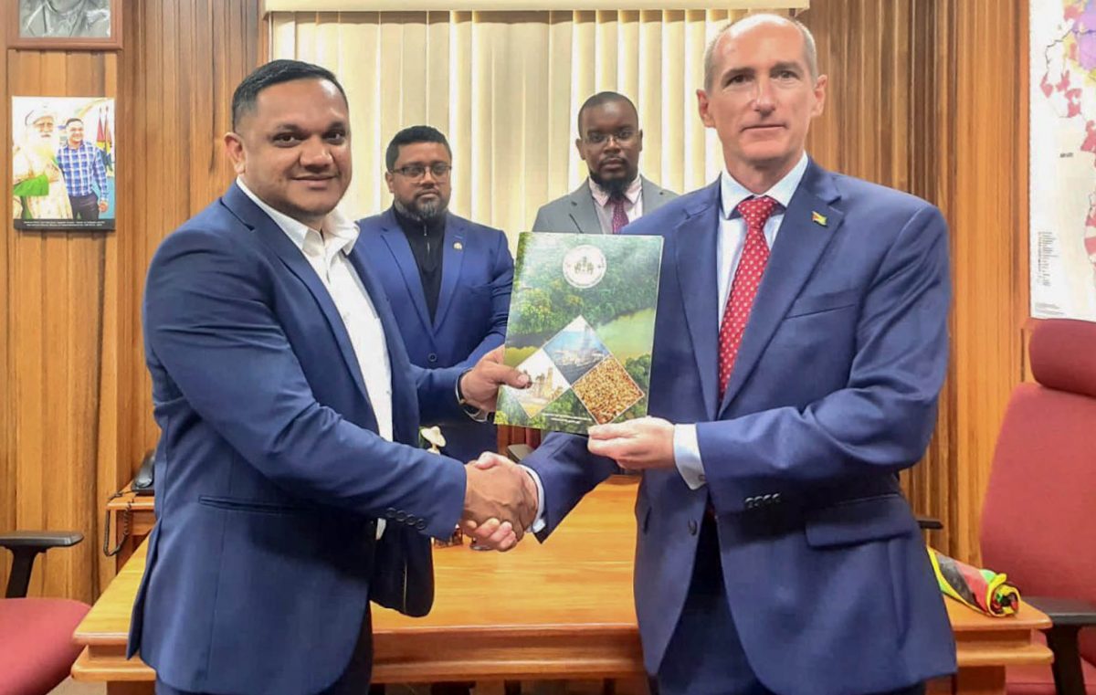 Minister of Natural Resources Vickram Bharrat (left) presented ExxonMobil Guyana President Alistair Routledge with a Letter of Approval for the company’s 2023 Annual Local Content Plan. (ExxonMobil photo)