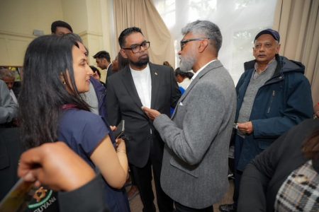 President Irfaan Ali interacting with Guyanese living in England at the Guyana High Commission in London. Ali had travelled to Britain to attend the coronation of King Charles III and Queen Camilla  (Office of the President Photo)