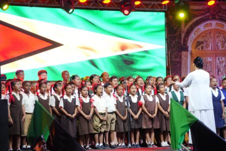 A children’s choir taking part in Thursday’s Independence Anniversary observance in Lethem. The event which was held at the Tabatinga Sports Complex was markedly different from previous years because of  Sunday’s deaths of 19 children in a fire at Mahdia. (Office of the President photo)

