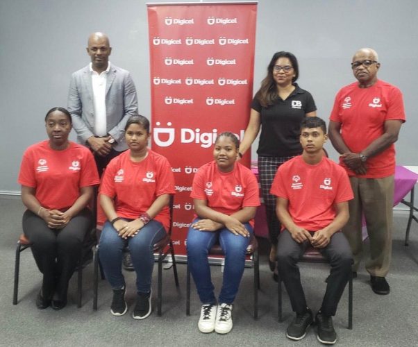 President of the Guyana Olympic Association, Godfrey Munroe, left, Digicel’s Guyana Communications Manager, Vidya Sanichara and Wilton Spencer, President of Special Olympics Guyana, right, along with three of the athletes and coach pose for a photo following yesterday’s presentation. 