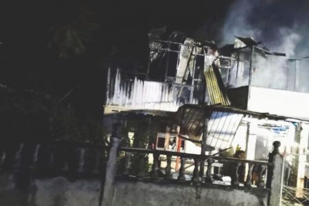 The remains of the two-storey wooden and concrete building that was engulfed in flames
