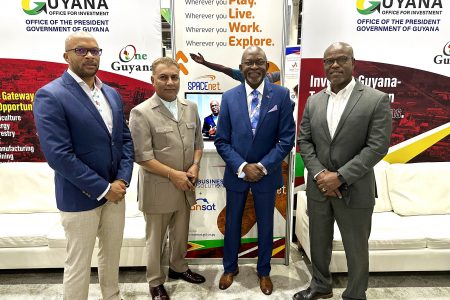 From the left are COO of GTT Business Solutions, Orson Ferguson; Chief Investment Officer of Guyana and Agency Head of the Guyana Office for Investment, Dr Peter Ramsaroop; CEO of Tagman Media Inc, Alex Graham, and CEO of WANSAT, Andre Jones, after the announcement was made at the Guyana Pavilion at Offshore Technology Conference 2023 being held in Houston, Texas