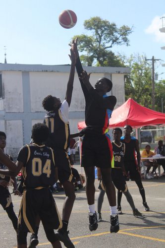 A scene from the Queen’s College and GTI encounter at the St. Stanislaus Hard-Court, Brickdam in the Youth Basketball Guyana (YBG) coordinated ExxonMobil ‘Regional Conference’ Championships 