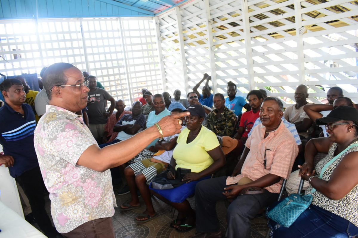 Commissioner of Police (ag) Clifton Hicken engaging the farmers at the meeting held at Mahaicony Police Station. 