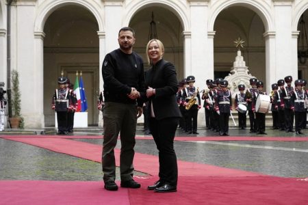 Italian Premier Giorgia Meloni, right, and Ukrainian President Volodymyr Zelenskyy shake hands before their meeting at Chigi Palace, Government's office, in Rome, Saturday, May 13, 2023. Zelenskyy is in Italy for a one-day visit and will meet with Pope Francis at The Vatican. (AP Photo/Alessandra Tarantino)