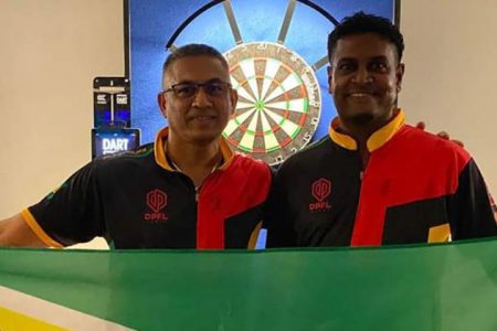 Norman Madhoo, left and Sudesh Fitgerald have qualified for next month’s Dart World Cup in Franfurt, Germany.