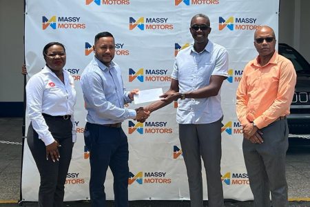 Head of the dealership of Massy Motors, Lahkan Mohamed presents the sponsorship cheque to Paton George of the Lusignan Golf Club while representatives of the company and club look on.