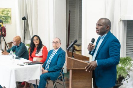 Minister Kwame McCoy addressing the GPA’s reception on World Press Freedom Day. Also in photo from right are Canadian High Commissioner Mark Berman, GPA President Nazima Raghubir and Denis Chabrol (Keynote Photography) 